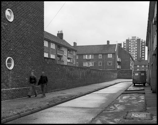 two men walking past boundary street